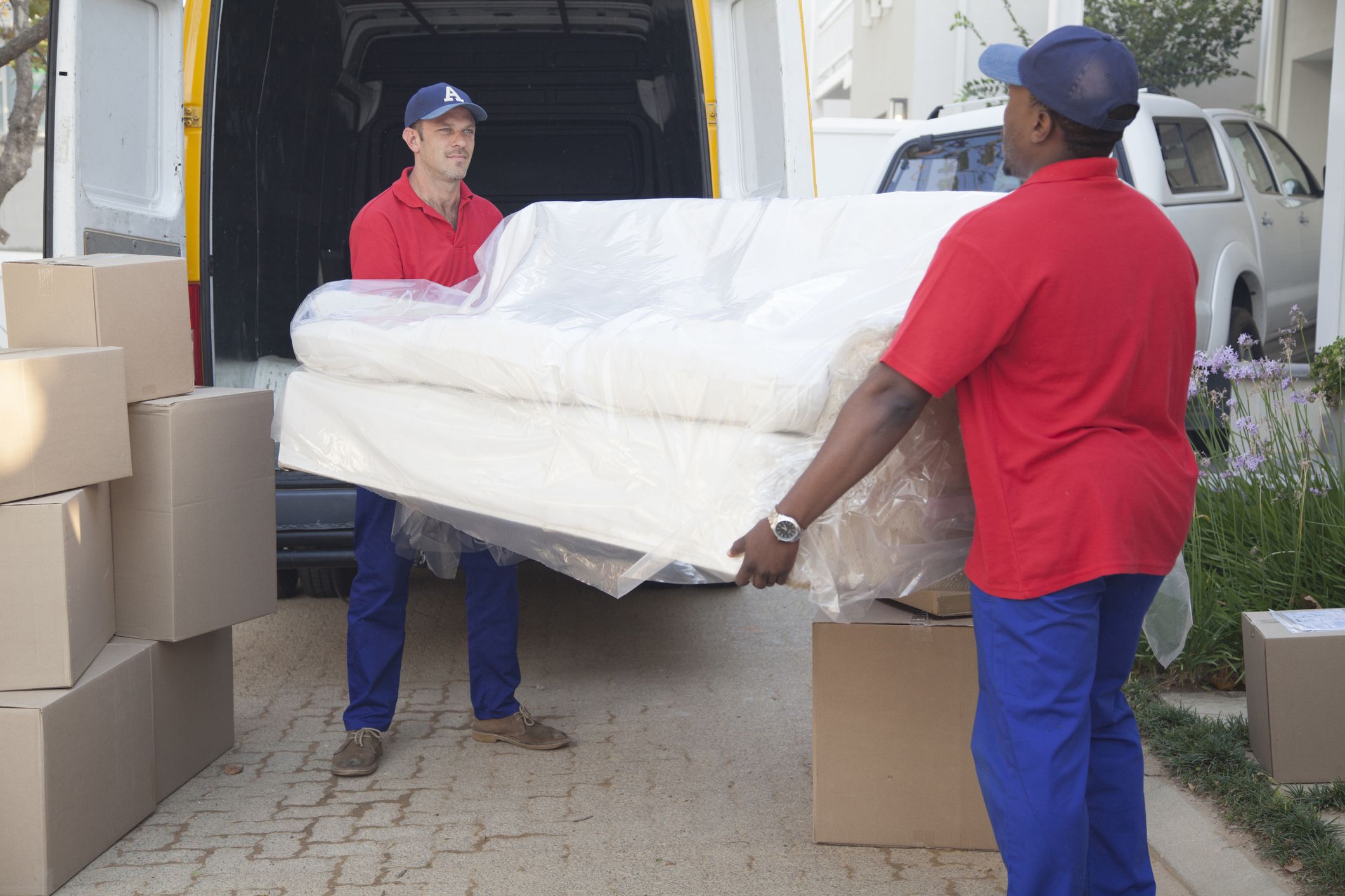 movers-carrying-sofa-to-new-home-royalty-free-image-1587748747
